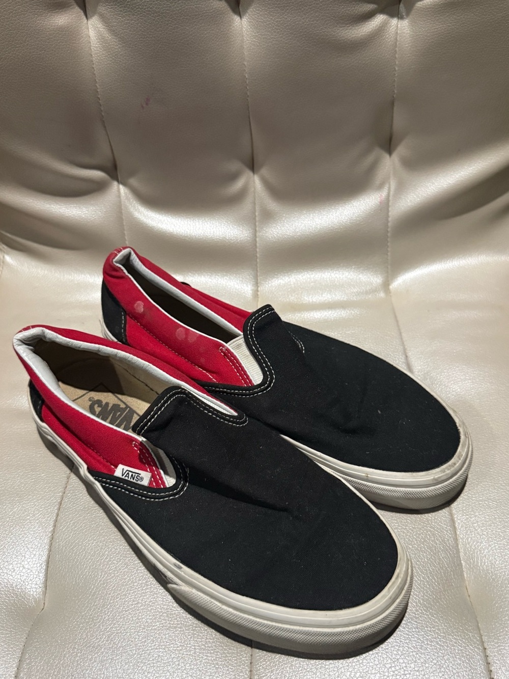 Vans Black Slip-On Sneakers with Red Lining